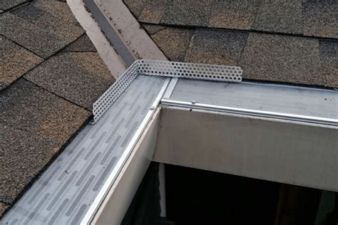 how do you get water away from house metal roof|metal roof water diverter.